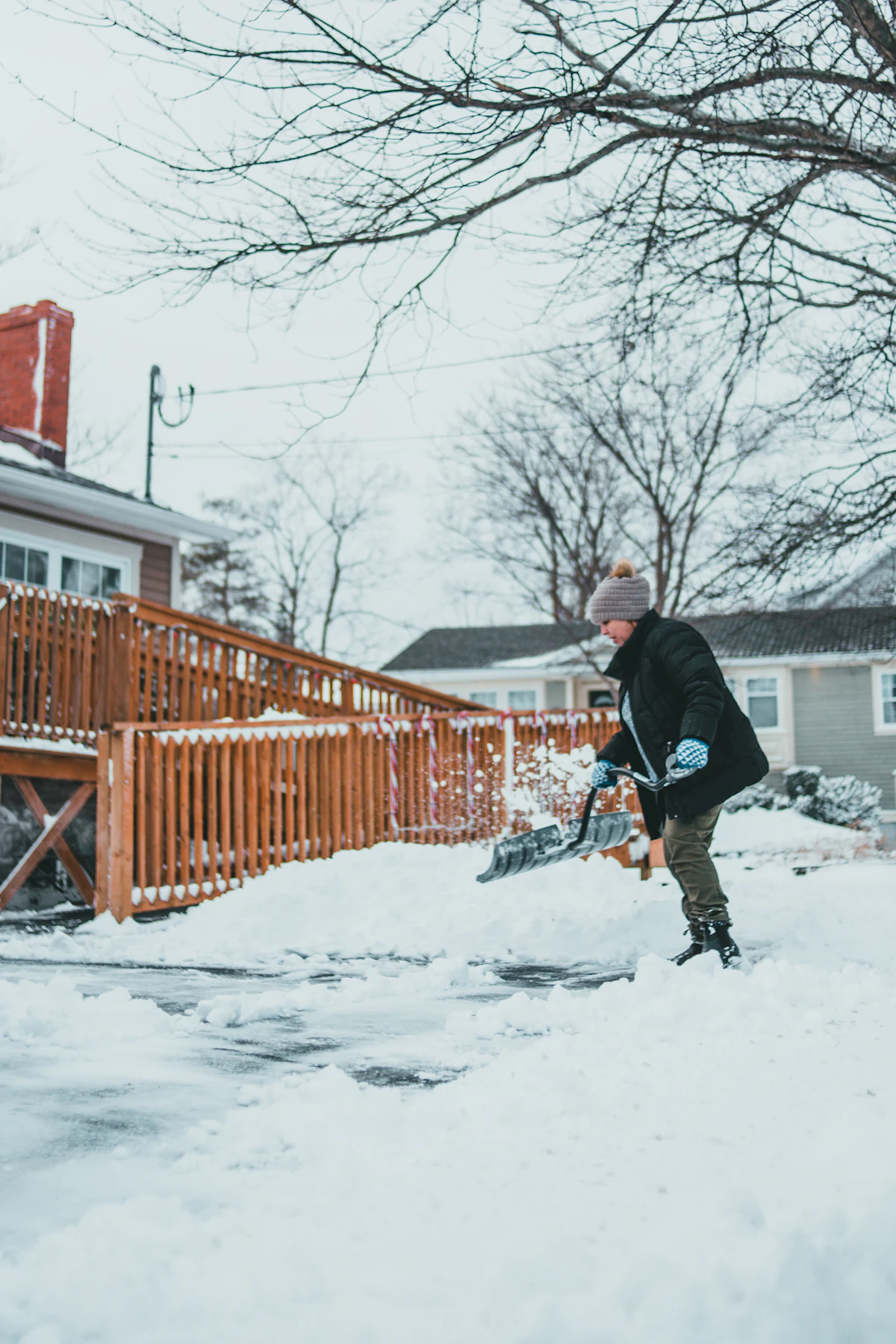 Man shoveling snow from a walkway