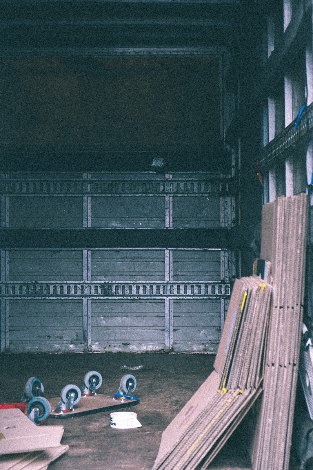 blue and white plastic bottle beside yellow and black step ladder