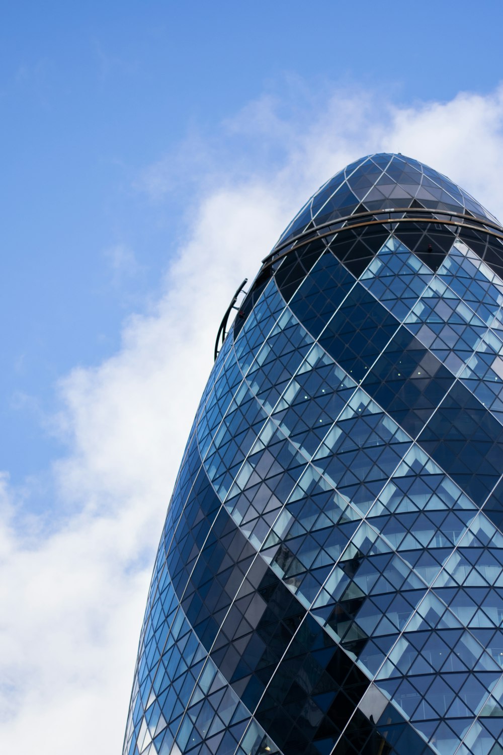 blue glass walled high rise building