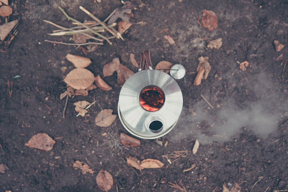 round gray and red metal tool