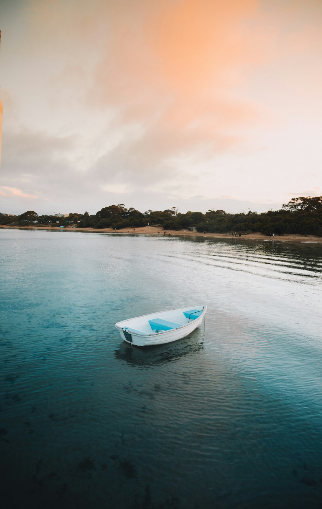 white and blue boat on water during daytime