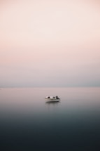 white boat on body of water during daytime