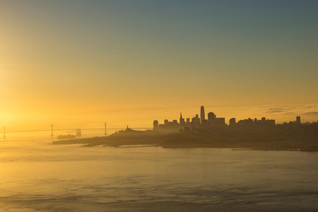 silhouette of city buildings during sunset