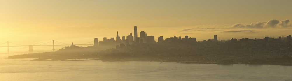 silhouette of city buildings during sunset