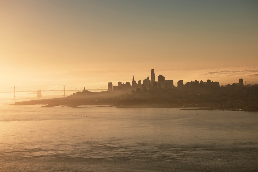 silhouette of city buildings during sunset