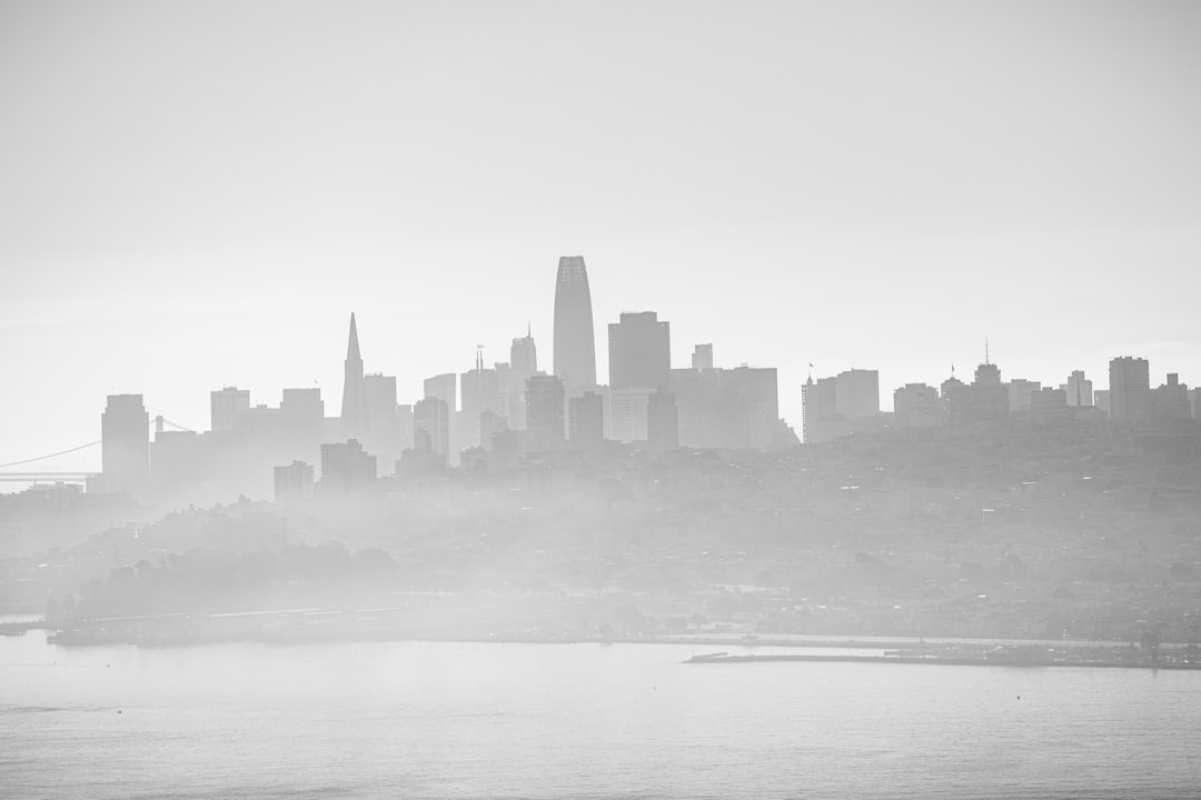 city skyline across body of water during daytime