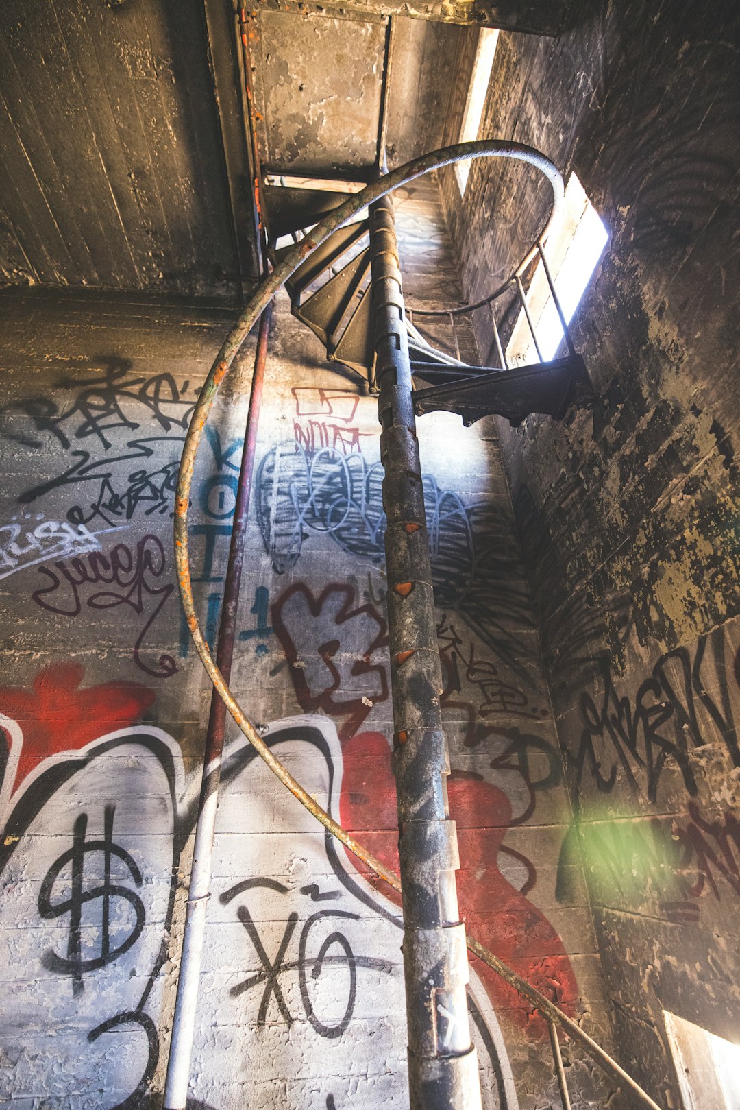 brown wooden ladder leaning on wall