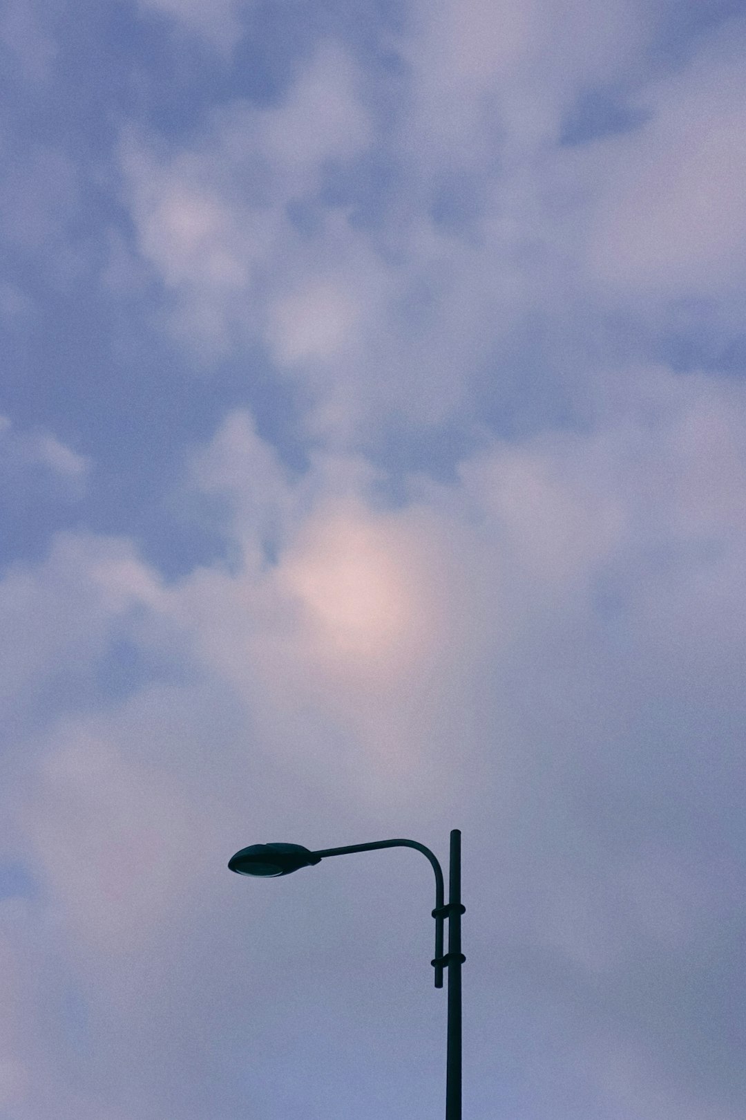 black street light under blue sky