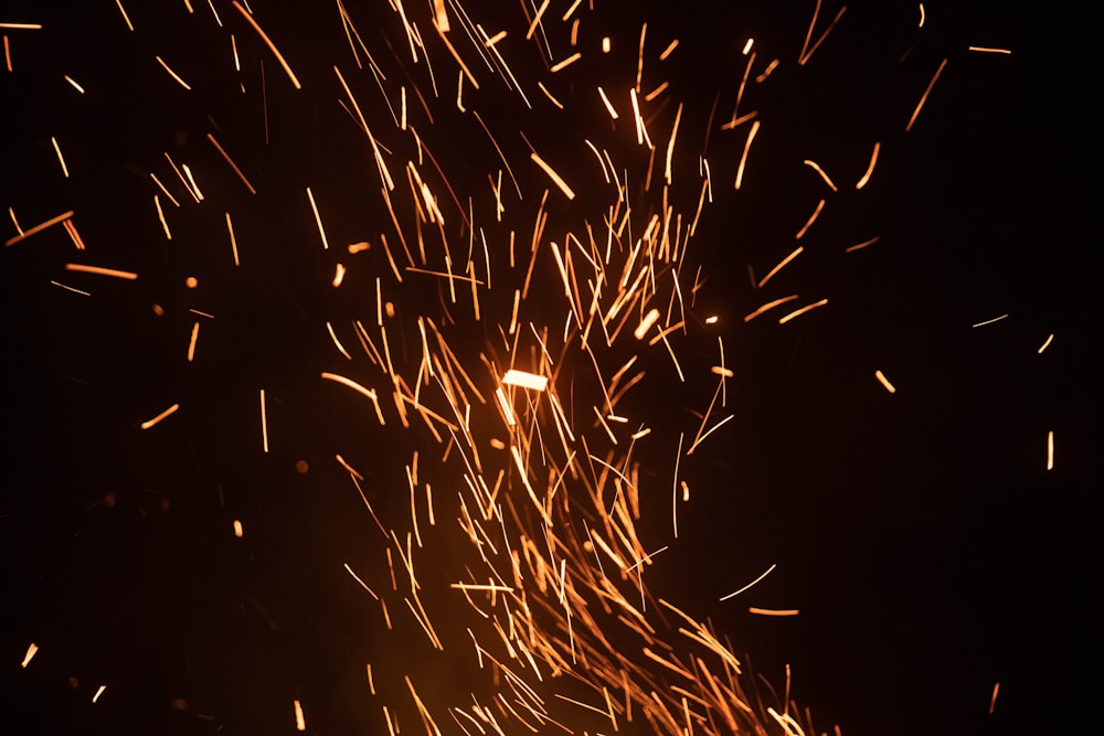 yellow and red fireworks in the sky