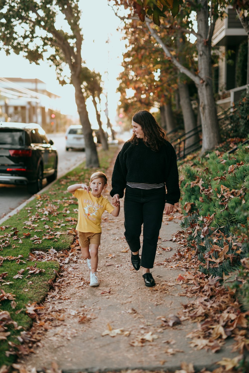 man in black long sleeve shirt carrying girl in yellow dress