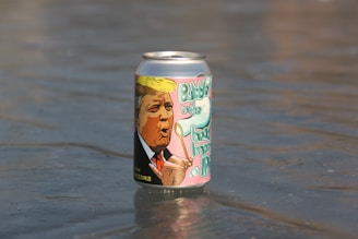 yellow and black can on water