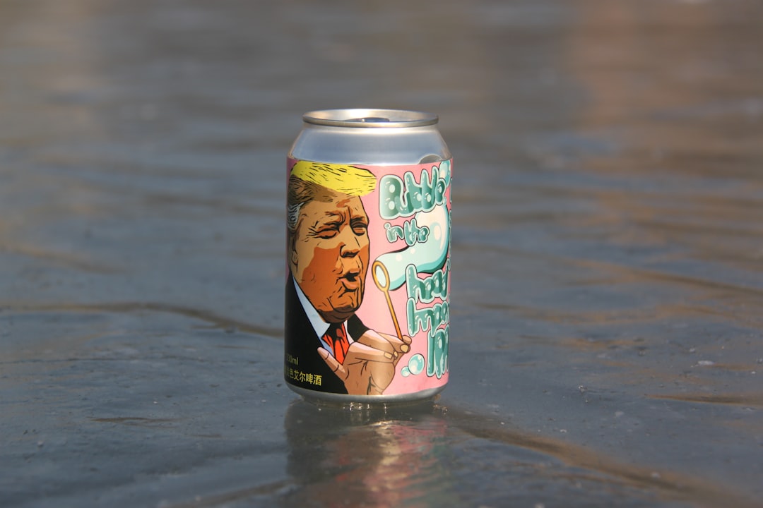 yellow and black can on water,