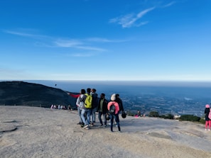 A group of friends taking a selfie at a famous landmark.