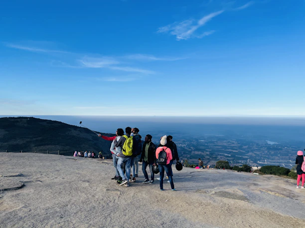 Group of friends taking a selfie with the Dubai skyline in the background.