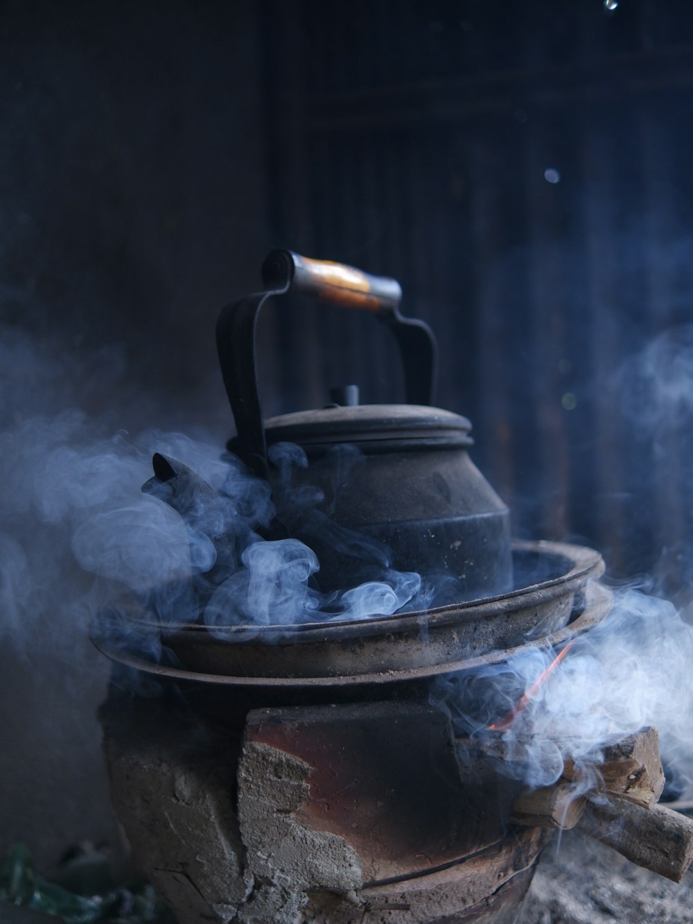 black kettle on black charcoal grill