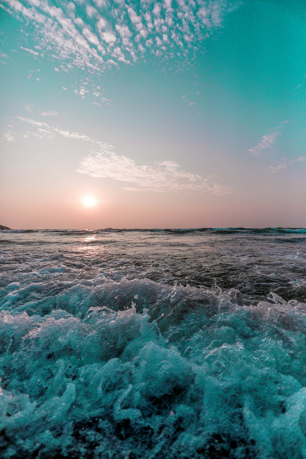 ocean waves under blue sky during daytime