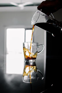 An artistic photo of the 4ormcoffee logo as a cinemagraph with coffee pouring smoothly.