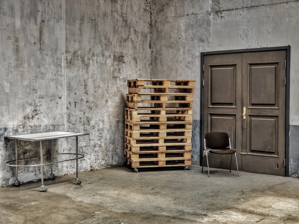 brown wooden crates beside brown wooden door