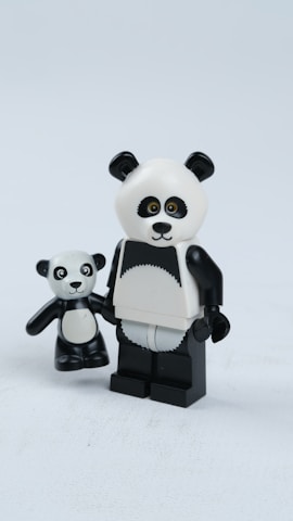 white and black panda figurine