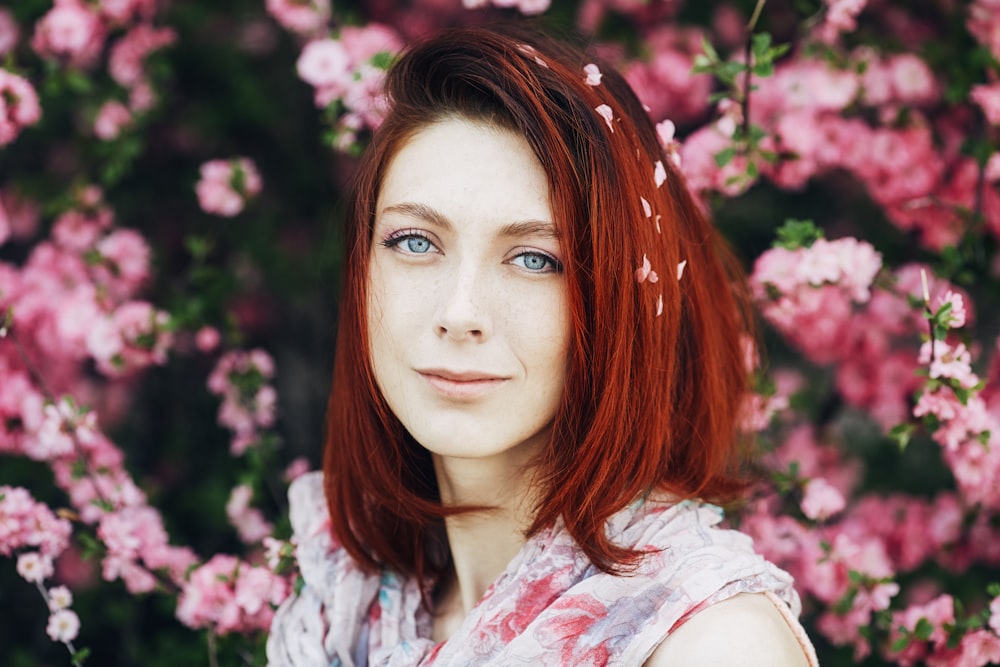 woman in white and pink floral shirt