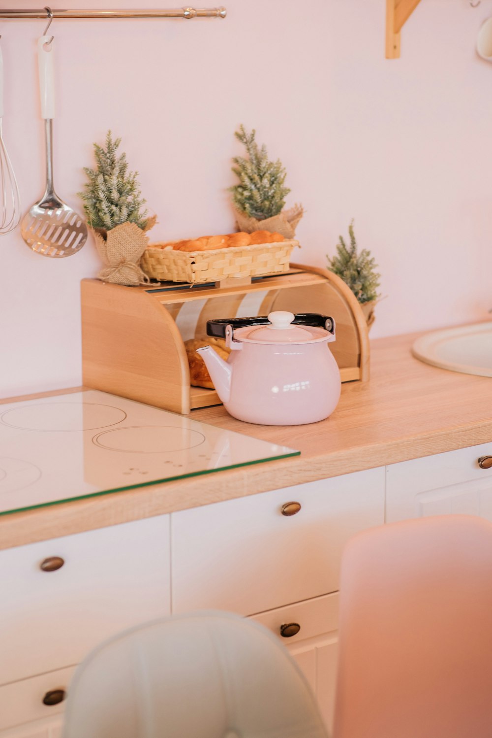 white ceramic teapot on brown wooden table