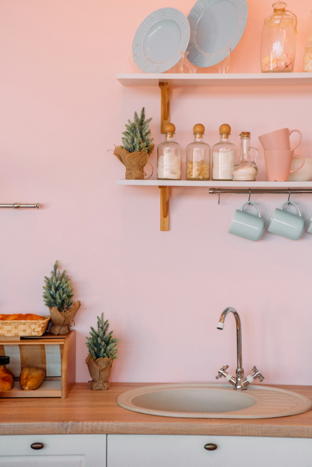 white ceramic mugs on brown wooden wall rack