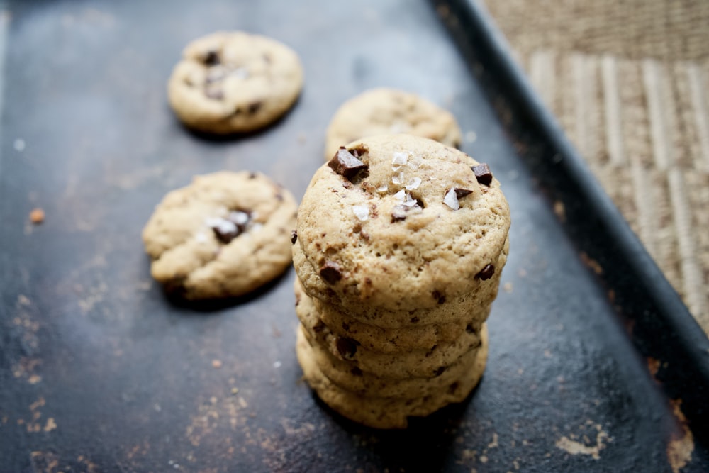 brown cookies on black surface