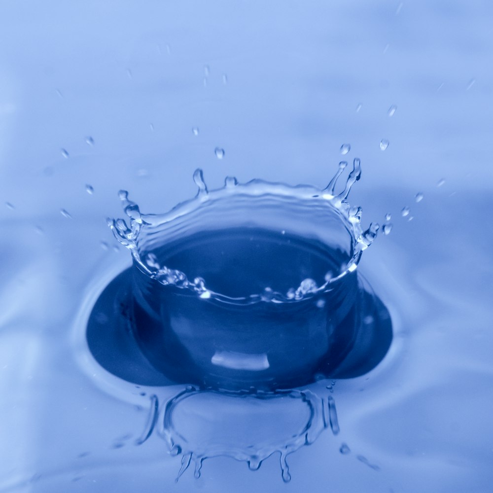 water drop on blue glass