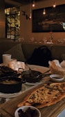 A cozy dining setup with warm lighting and appetizing meals.