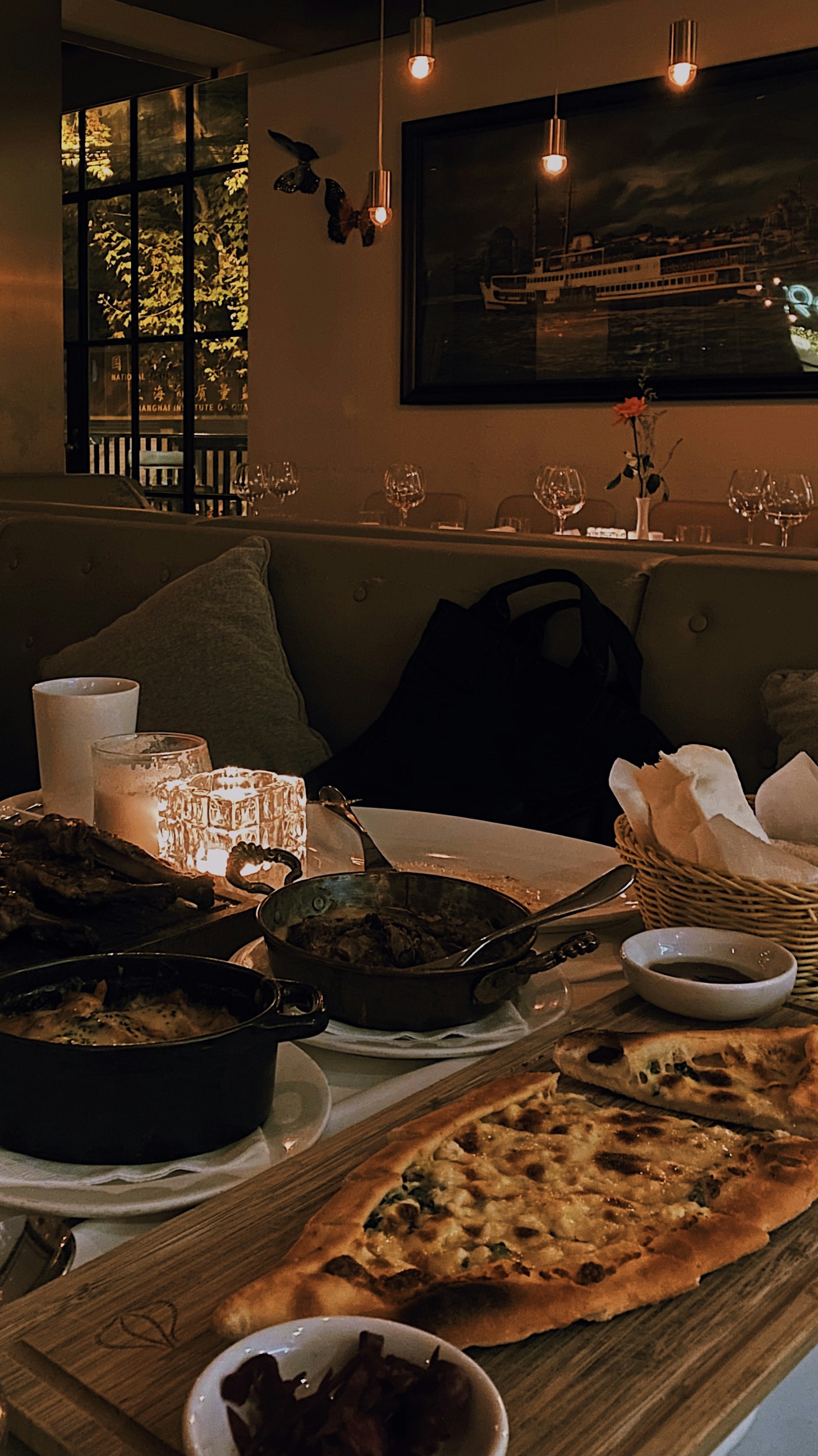 A cozy dining setup at Mille Luce, featuring elegant table settings and warm lighting.
