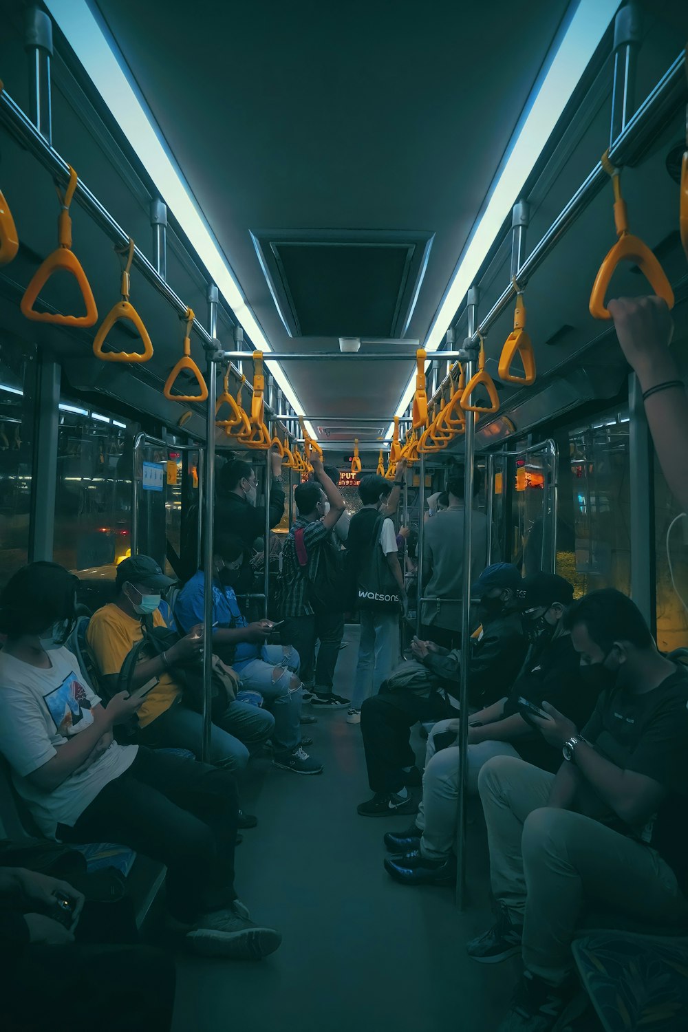 people sitting on bus seat