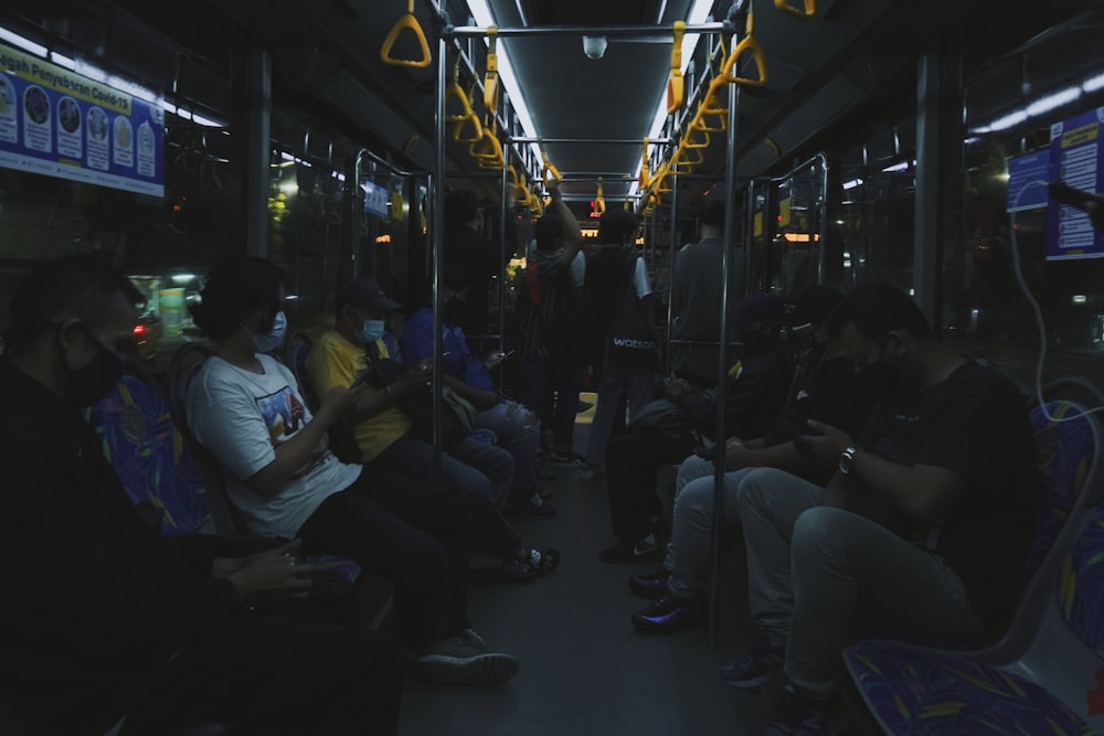 people sitting on bus seat