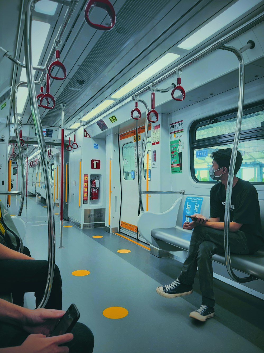 woman in black jacket sitting on train seat