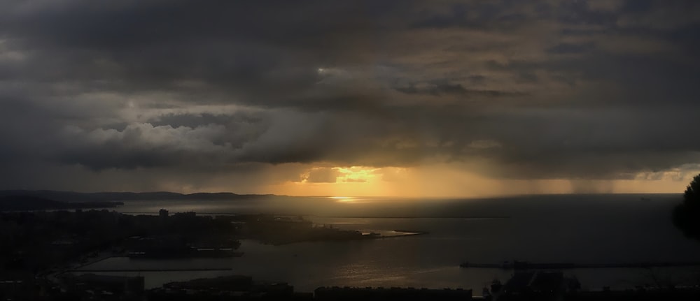 clouds over city during sunset