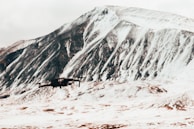 A drone conducting an emergency response mission near a remote mountain village.