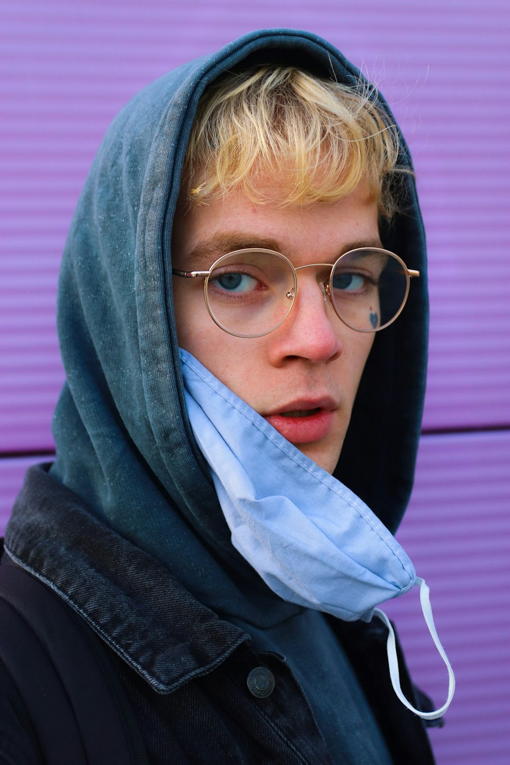 woman in black jacket wearing eyeglasses