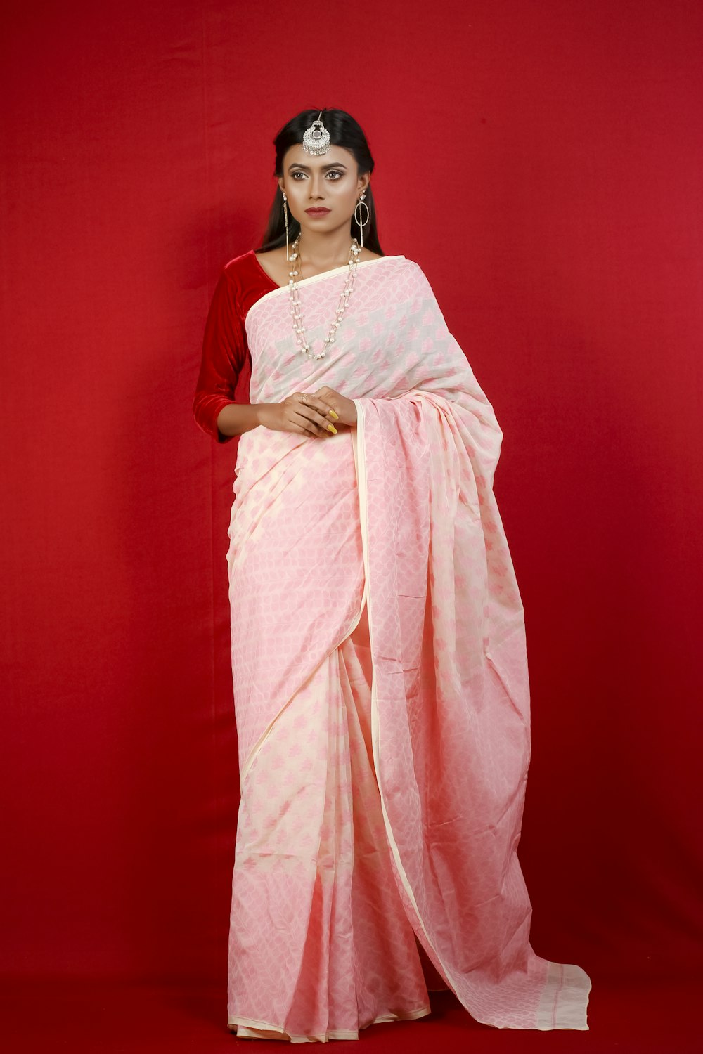 woman in pink and white sari dress