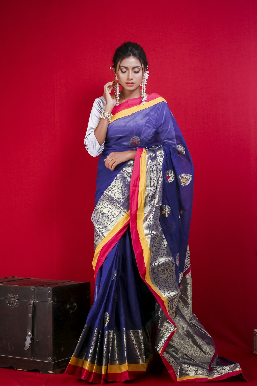 woman in blue and red sari dress