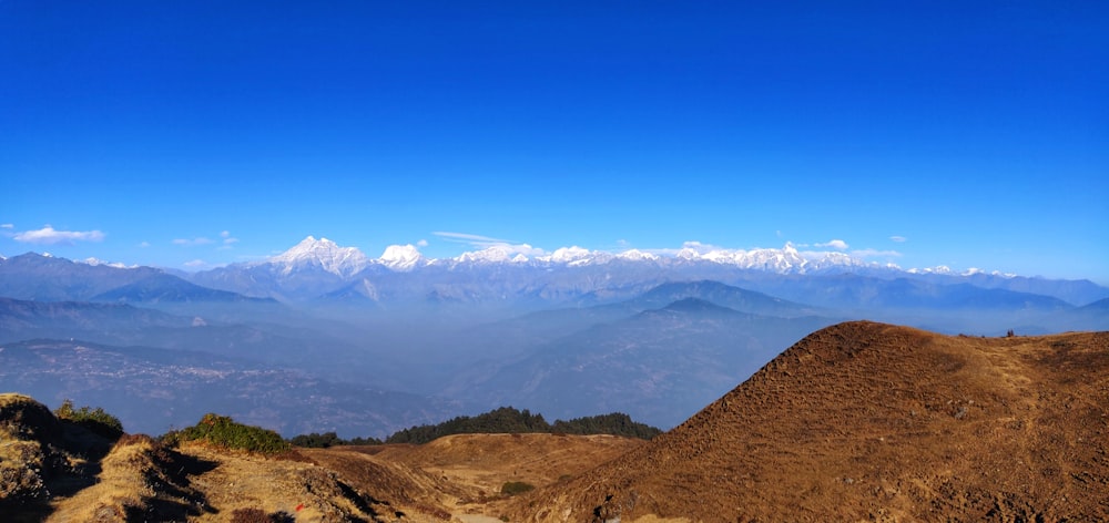 brown and green mountains under blue sky during daytime