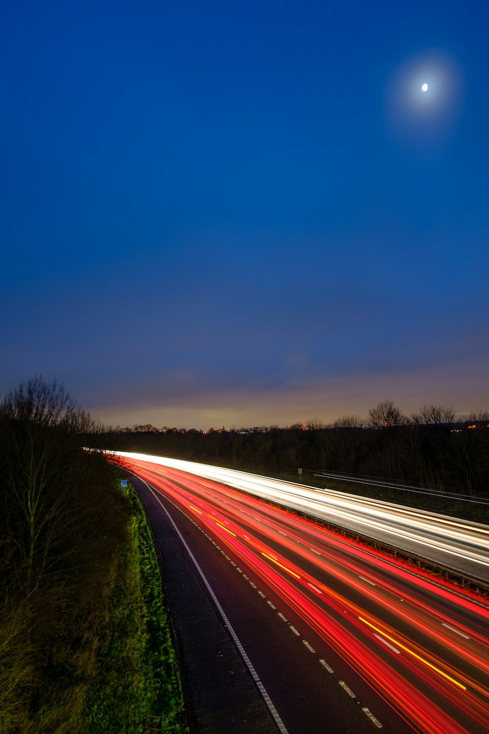 time lapse photography of road during night time