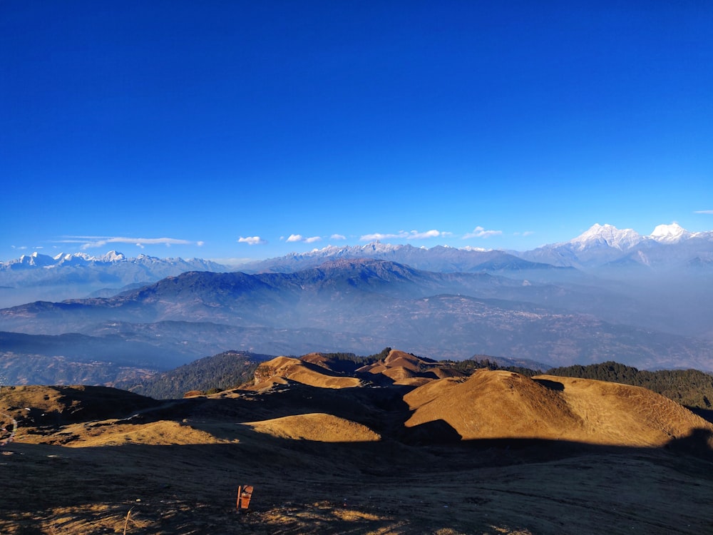 brown mountain under blue sky during daytime