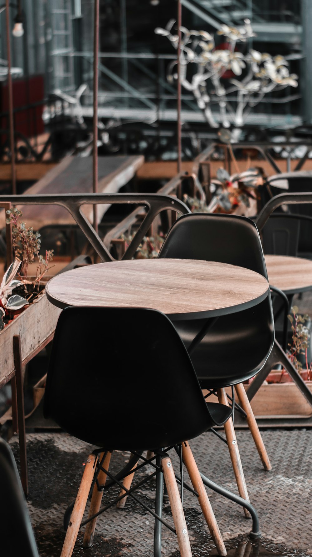 brown wooden table with black chairs