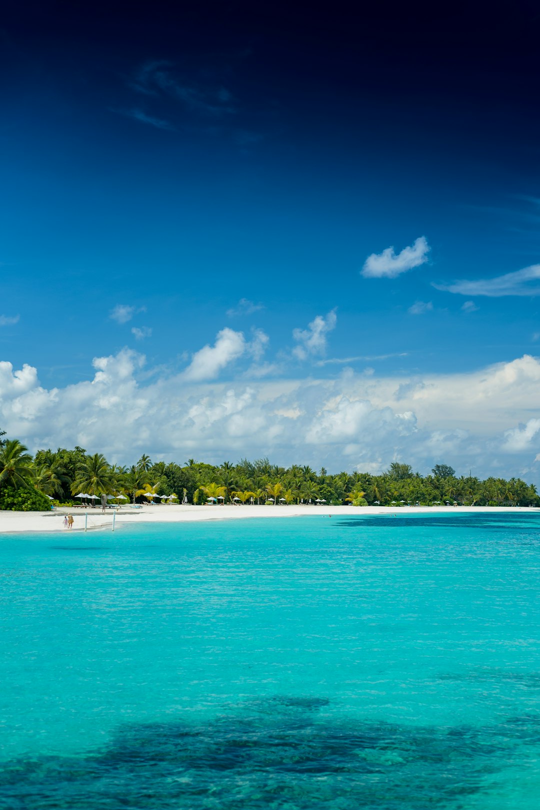 white boat on blue sea under blue sky during daytime