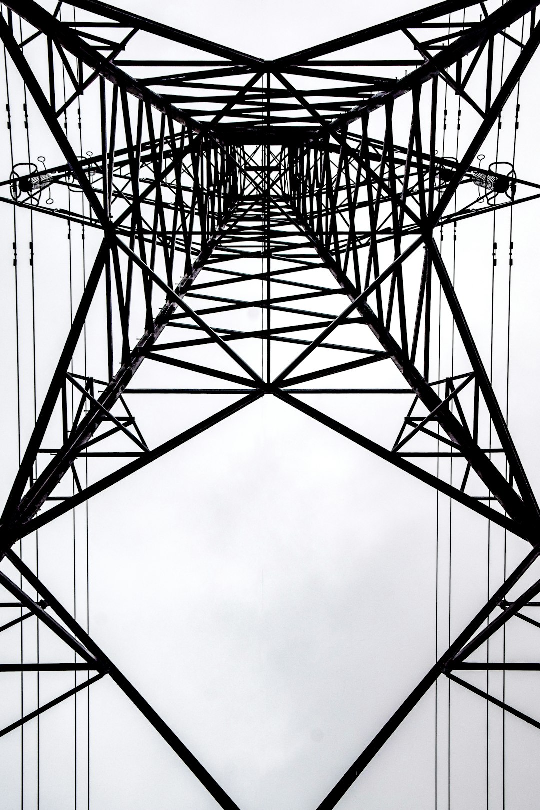 black metal tower under white clouds