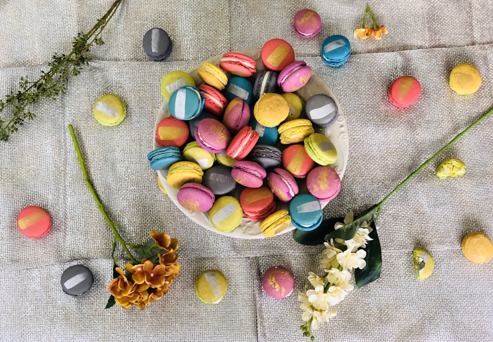 assorted candies on green textile