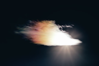 A glowing digital cloud surrounded by a protective shield of light.