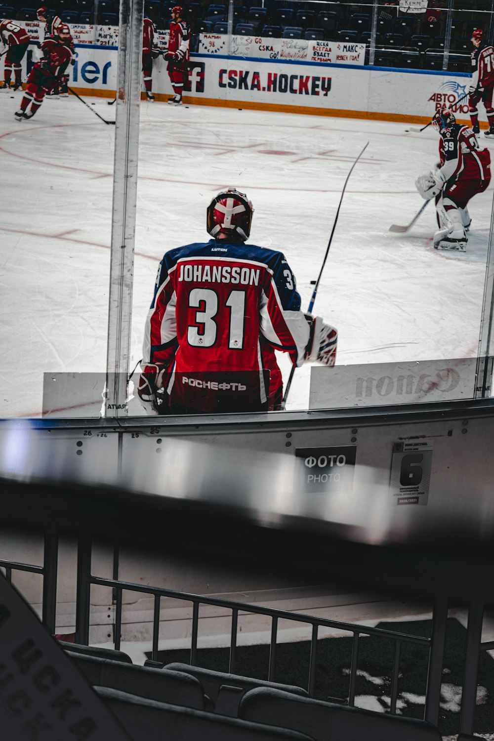 man in red and white ice hockey jersey shirt