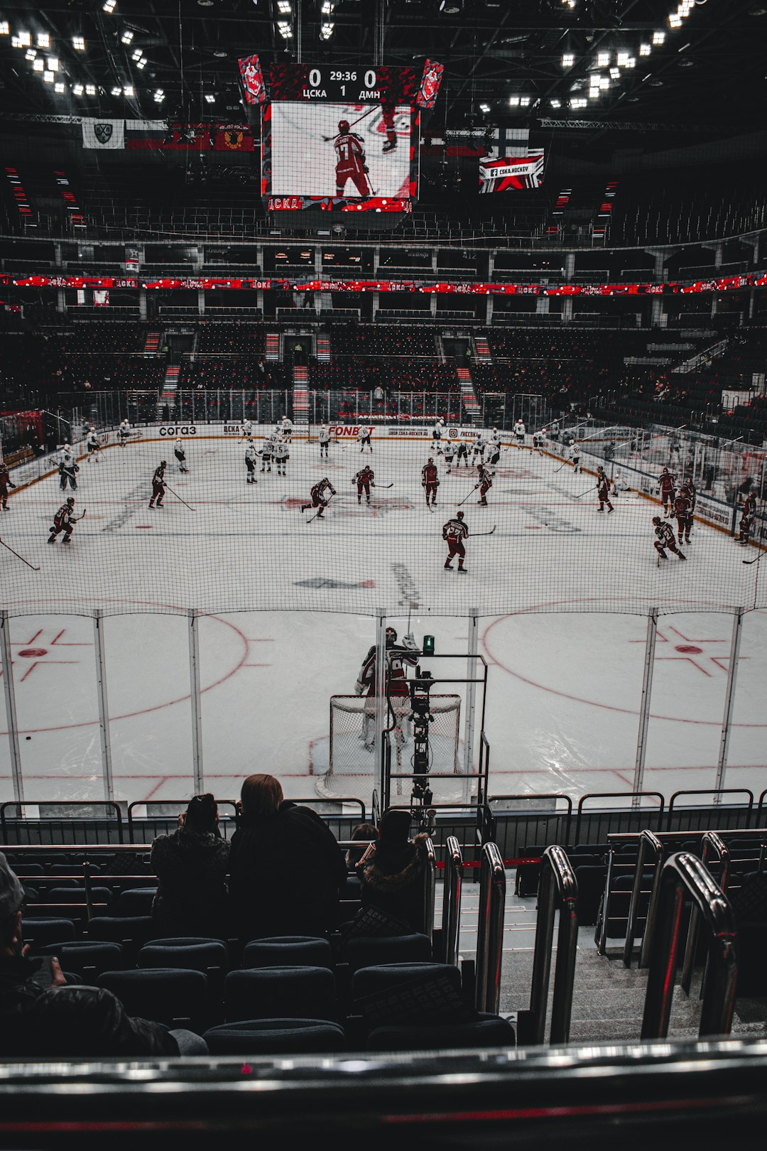 people playing ice hockey on ice stadium