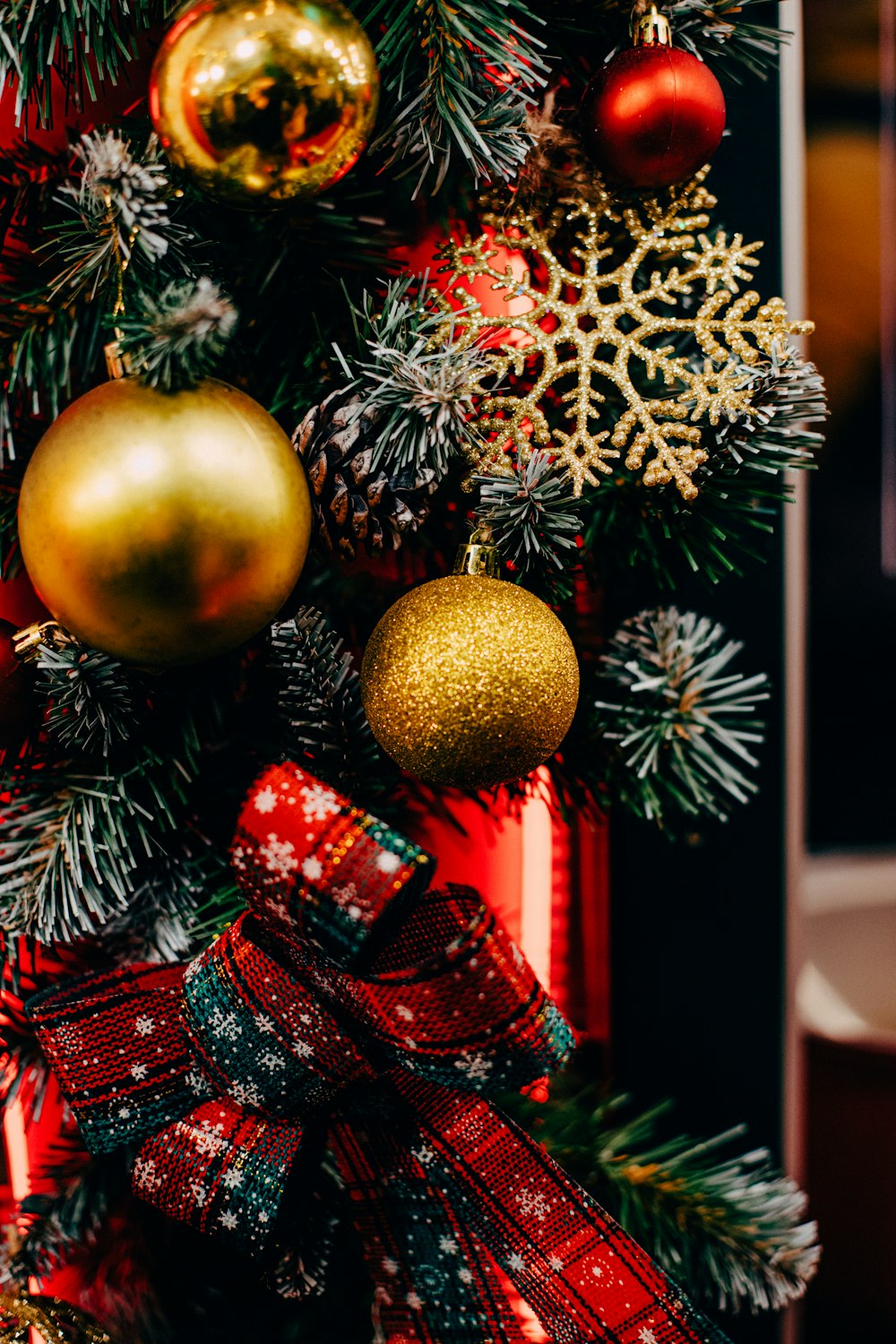 gold bauble on christmas tree