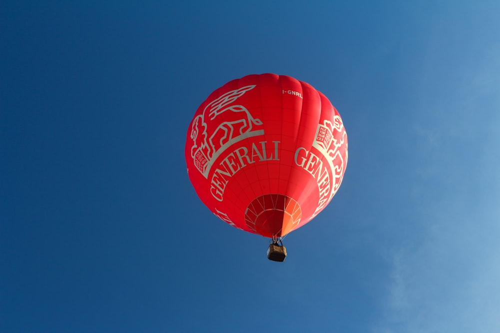 red hot air balloon in the sky